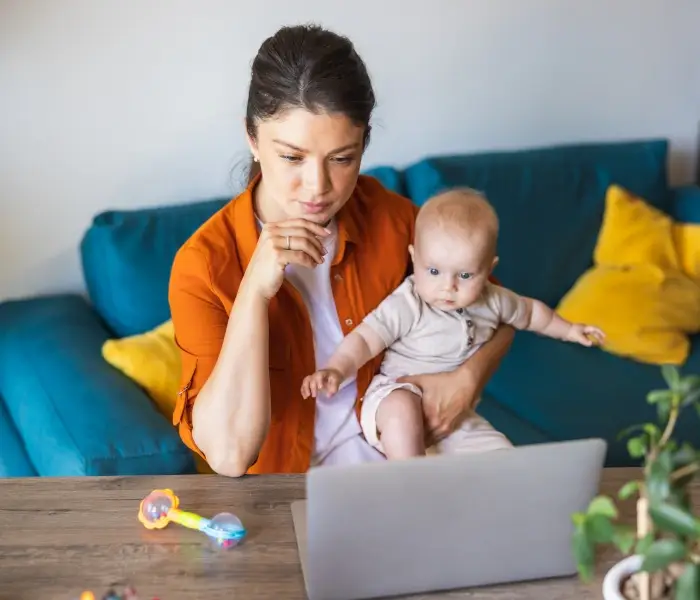 new-mom-with-perinatal-anxiety-and-ocd-intently-listening-to-perinatal-specialist-in-online-therapy-session