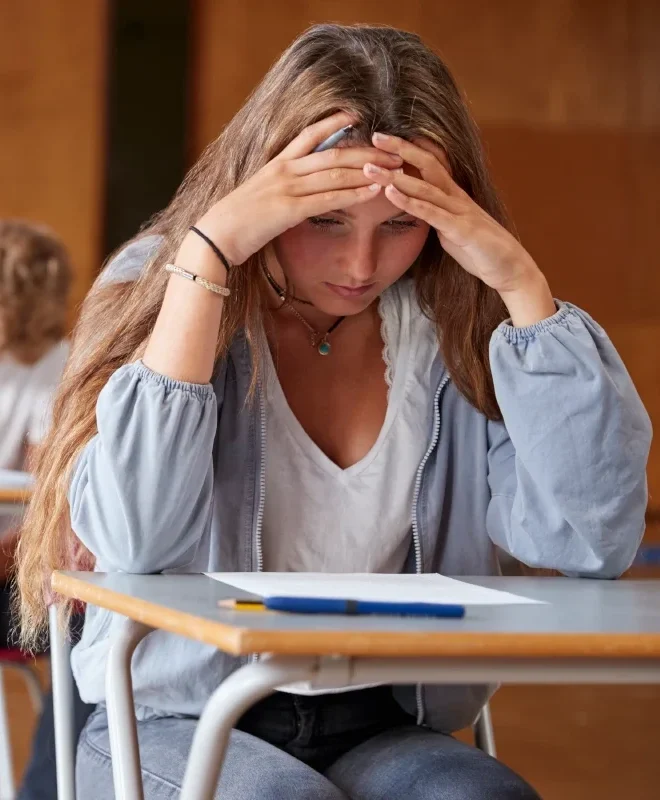 college-girl-taking-test-having-anxiety-about-failing