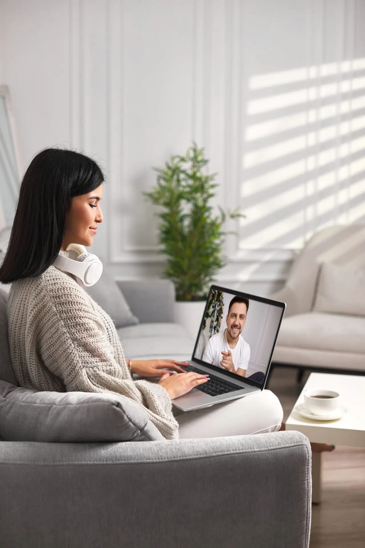 young-woman-talking-with-trauma-therapist-on-laptop-in-a-virtual-therapy-session